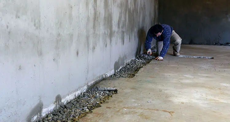 Interior basement waterproofing work in progress
